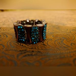 Chocolate bronze and blue crystal elastic ring.